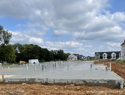 Foundation Posts on Fresh Concrete Pour