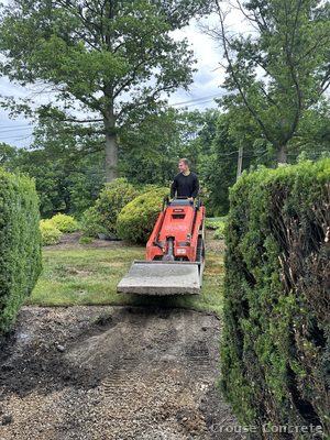 Skid-Steer Hauling Concrete to the Pour